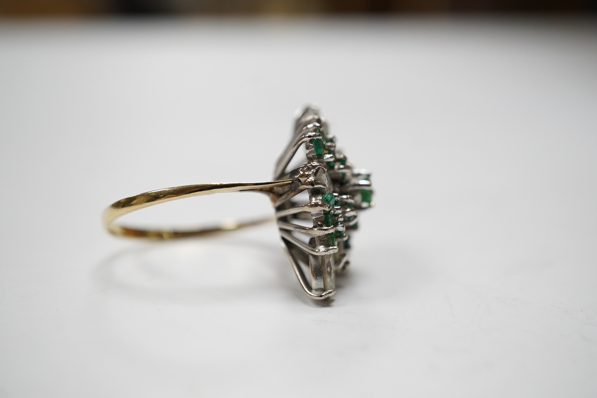 A modern 14ct gold, marquise cut diamond and round cut emerald cluster ring, size P/Q, gross weight 5.5 grams. Condition - poor to fair.